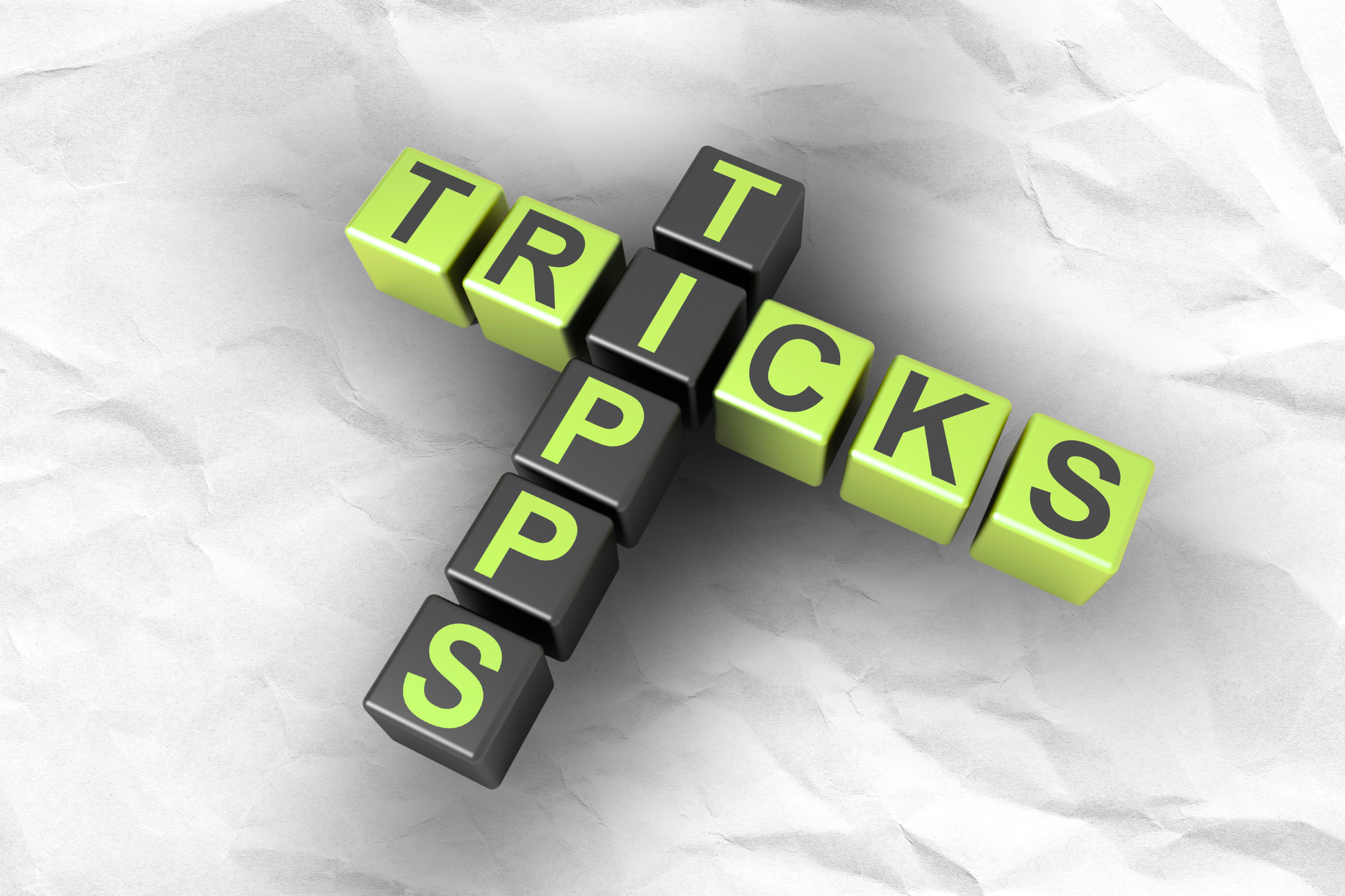 Darstellung von den Wörtern "Tipps" und "Tricks", aufgebaut wie bei dem Brettspiel "Scrabble".